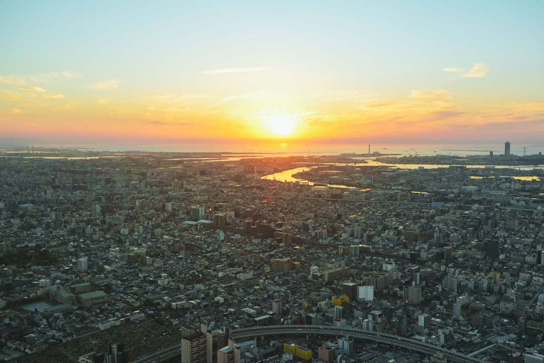 Aerial view of a sprawling city at sunset
