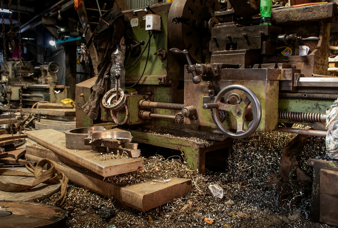 Old industrial lathe machine with metal shavings