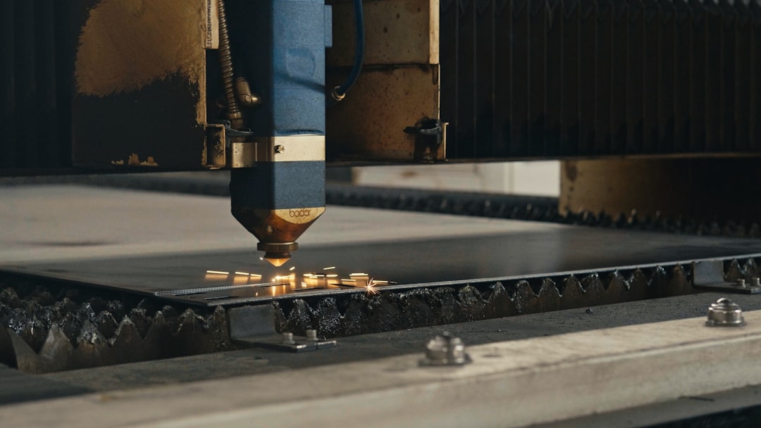 A machine that is cutting a piece of metal